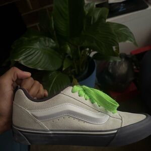 Vans. Size 10 in women’s white and purple with cool shoe strings